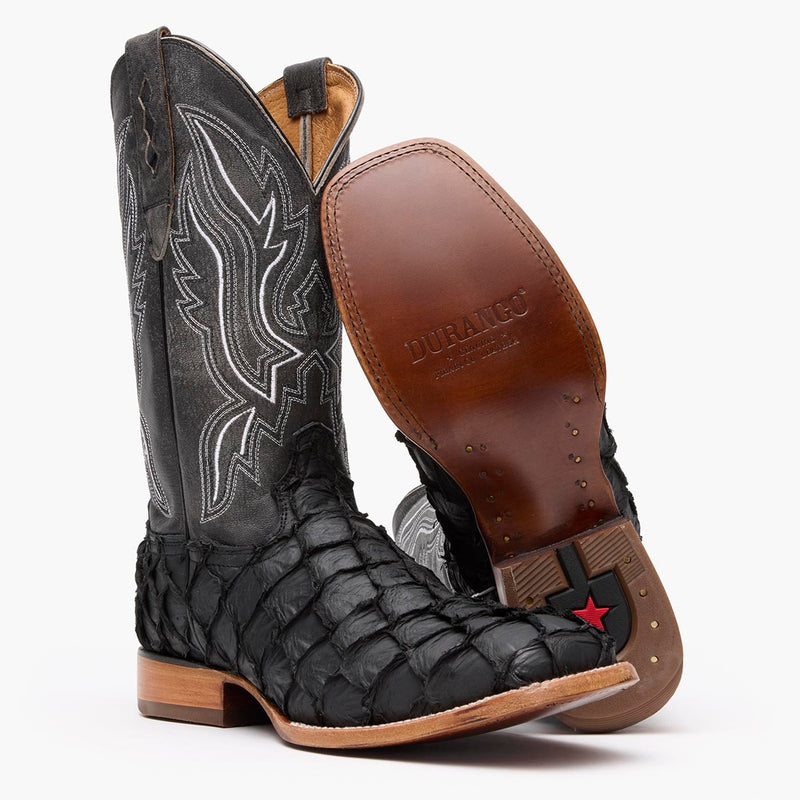 Leather outsole view of a pair of Durango black square toe Pirarucu fish western boots
