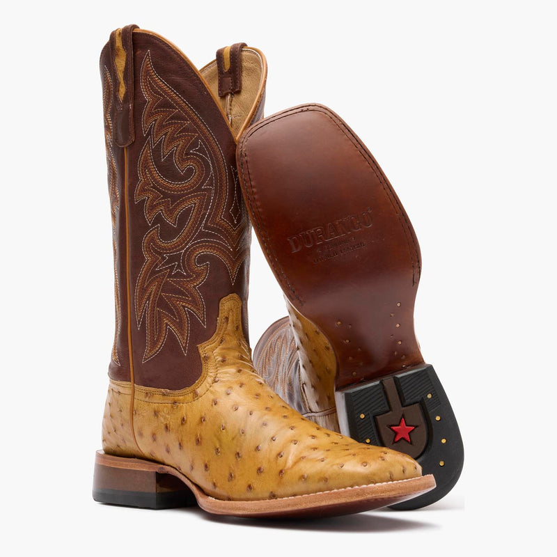 Front view of Durango Premium Exotic brown square toe Ostrich western boot showing leather outsole