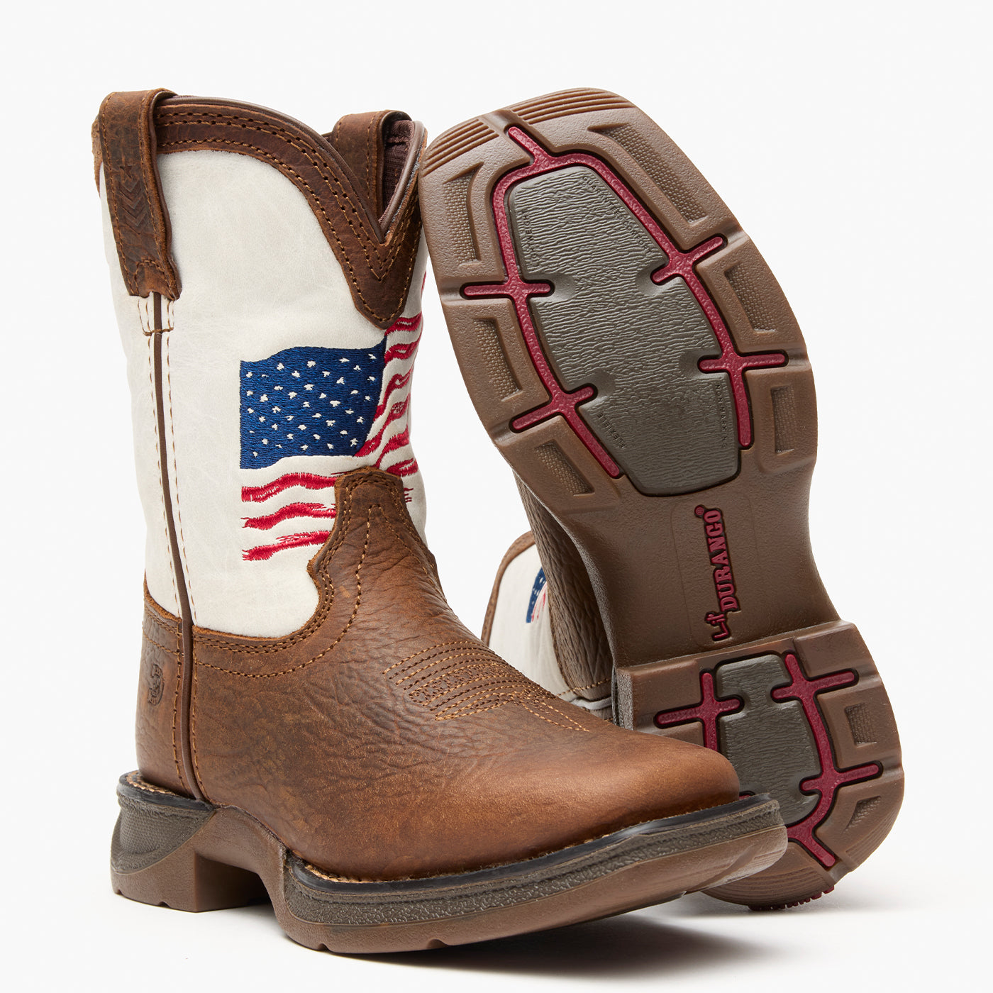 Brown and white kids western boot with American flag design on a grey background