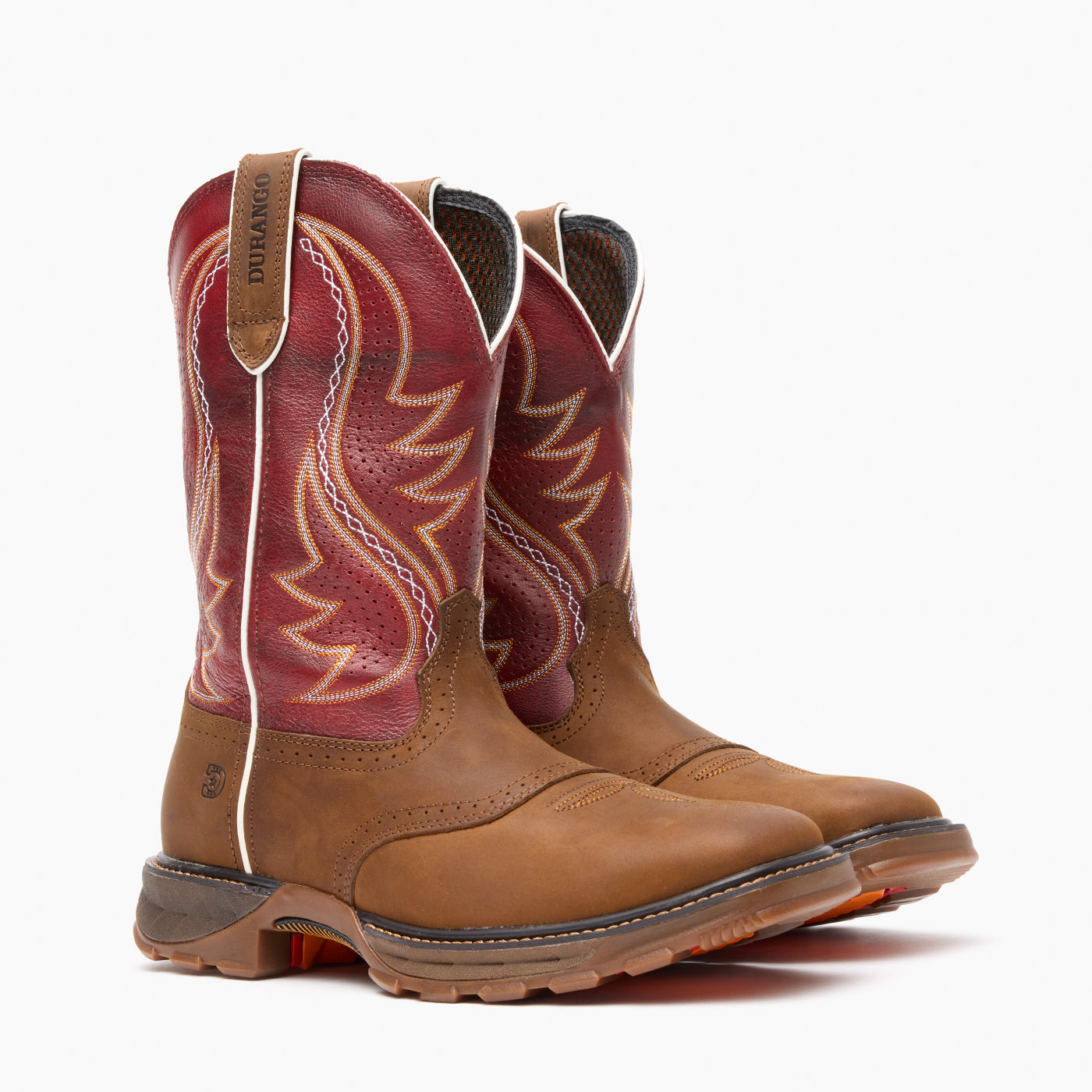 Pair of brown and red cowboy boots on a white background
