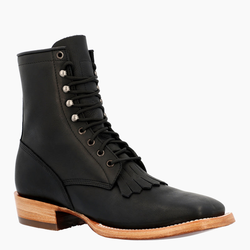 A black leather lace-up ankle boot with a fringed detail at the ankle, set against a plain white background.