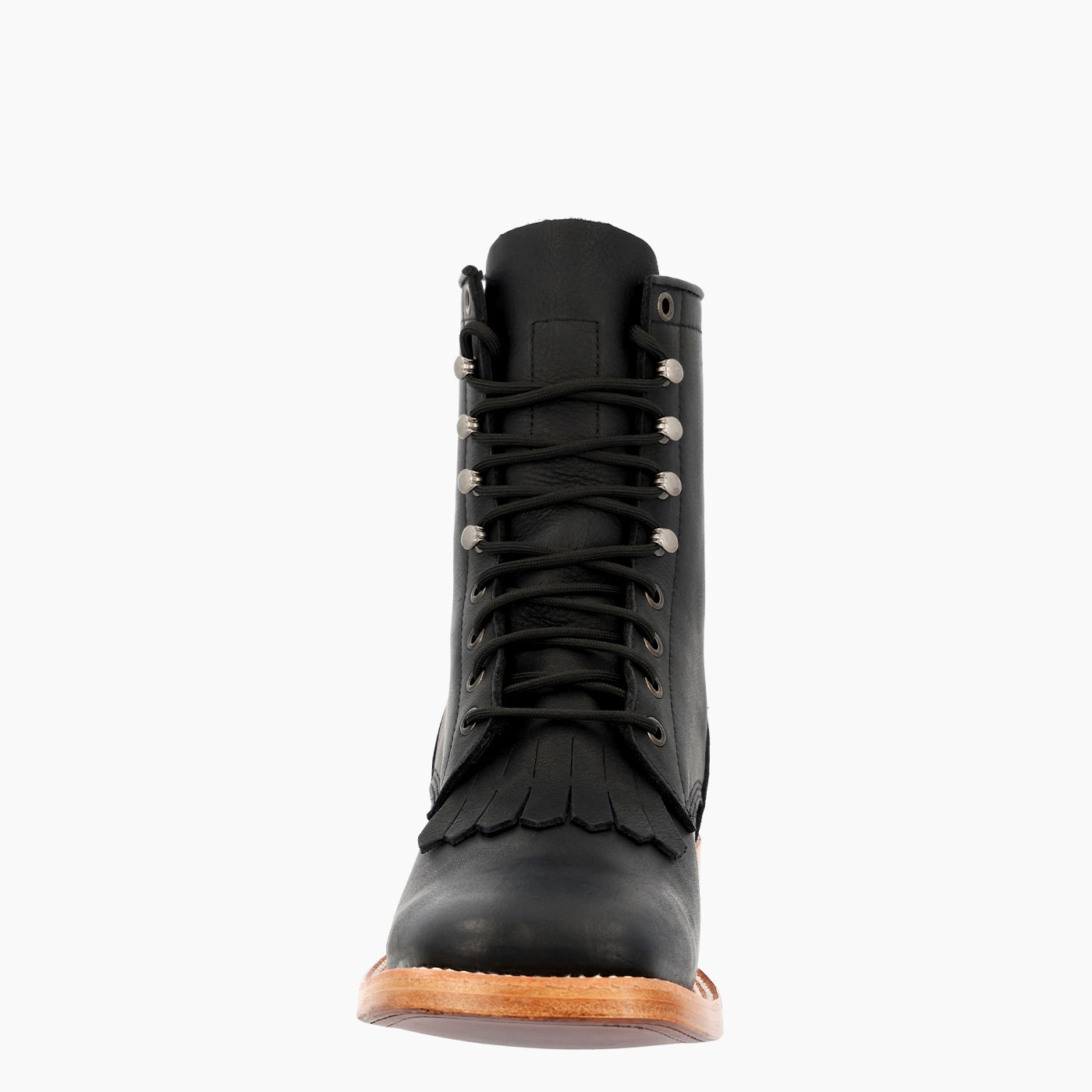 A single black leather lace-up boot with fringe detailing and silver metal eyelets, shown from a front-facing perspective on a light gray background.