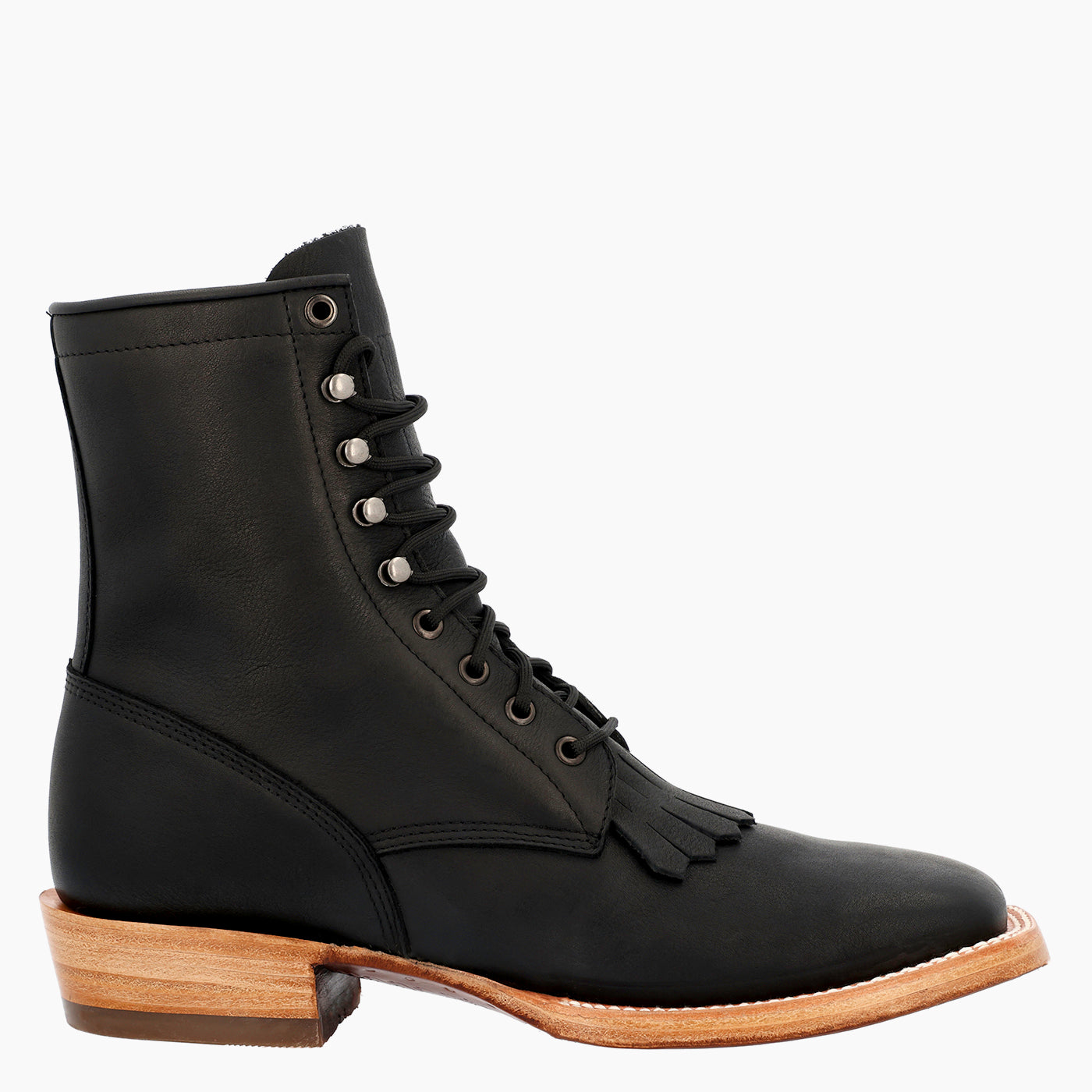 A black leather lace-up ankle boot with a low stacked leather heel, tassel detail on the vamp, and silver metal eyelets, shown from a side profile against a plain white background.