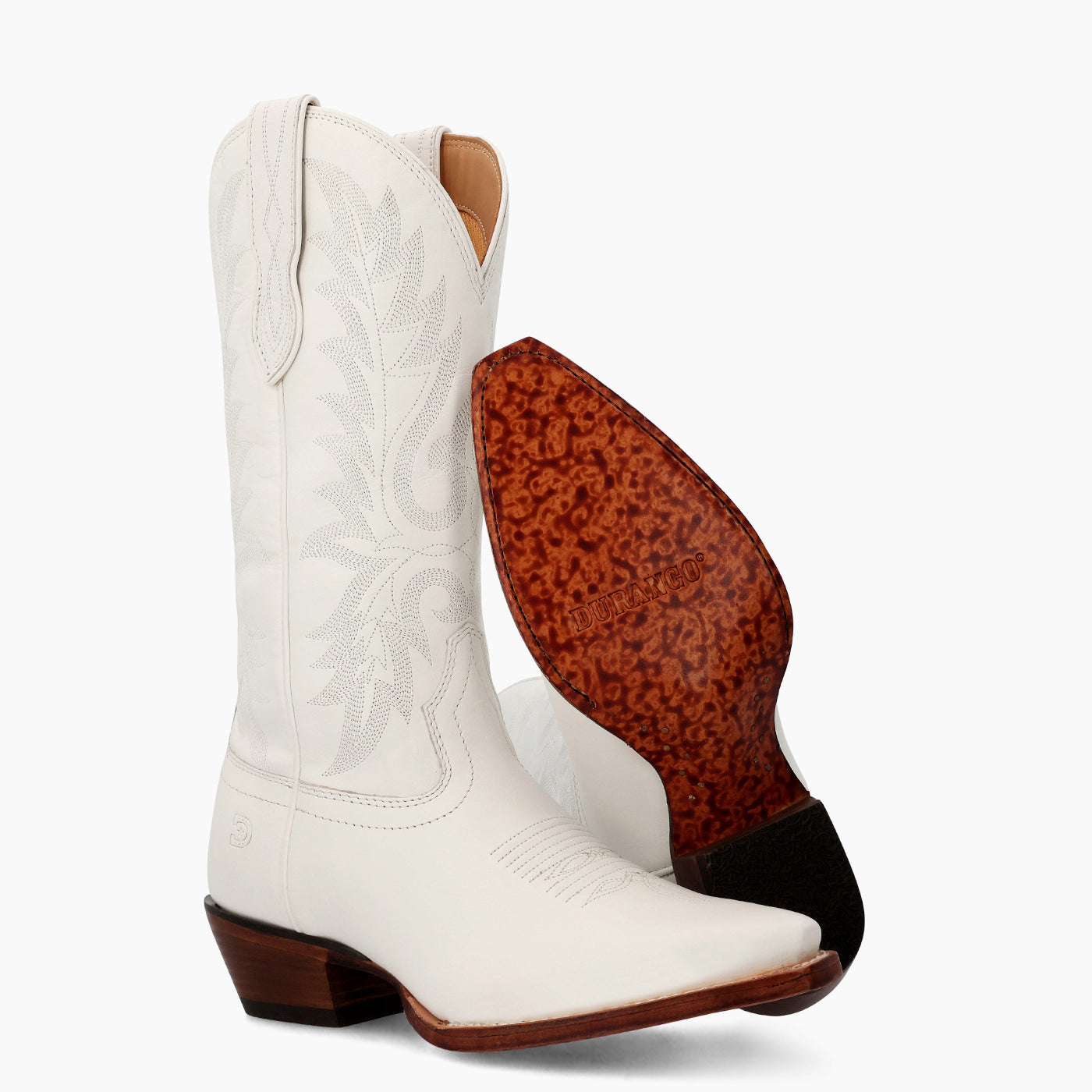 Front view of a pair Durango women's white cowgirl boots with leather outsole showing