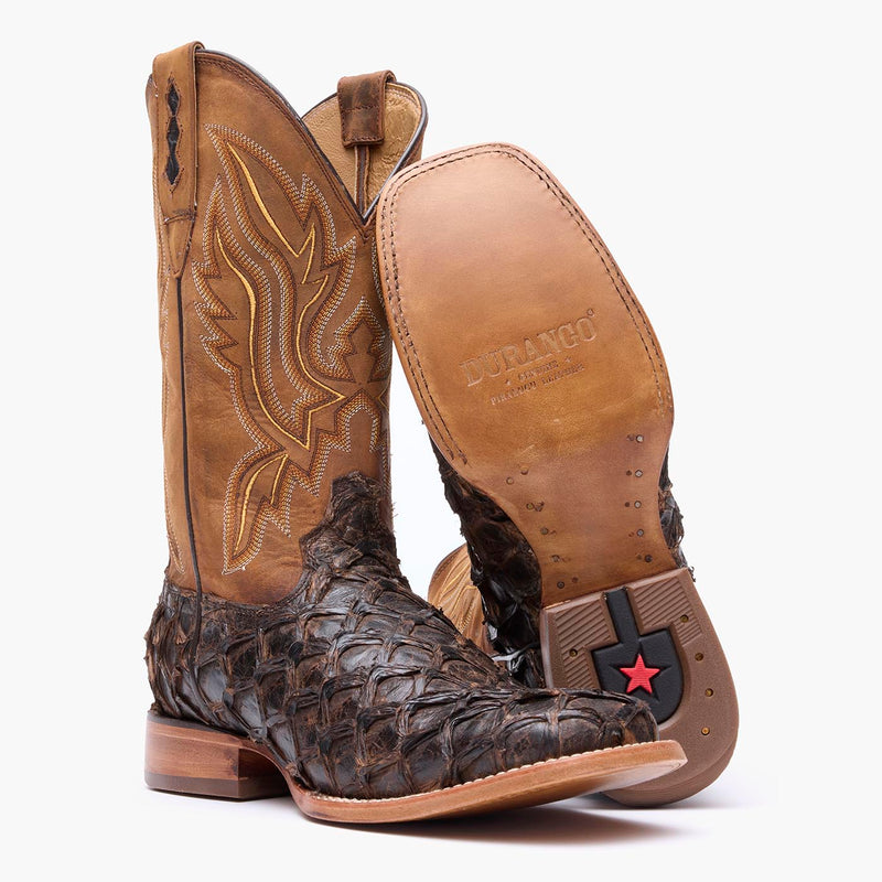 Leather outsole view of Durango brown square toe Pirarucu fish western boots