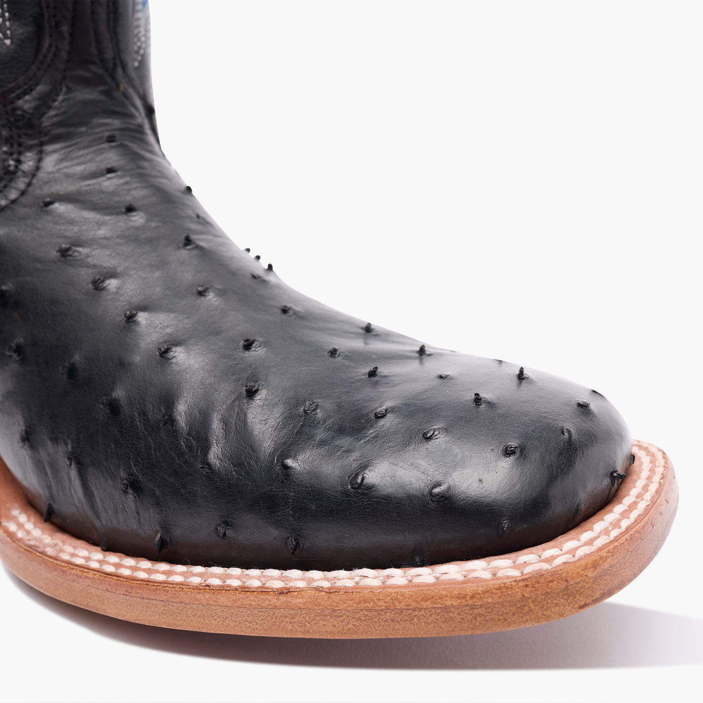 Close up of Durango black ostrich square toe western boot