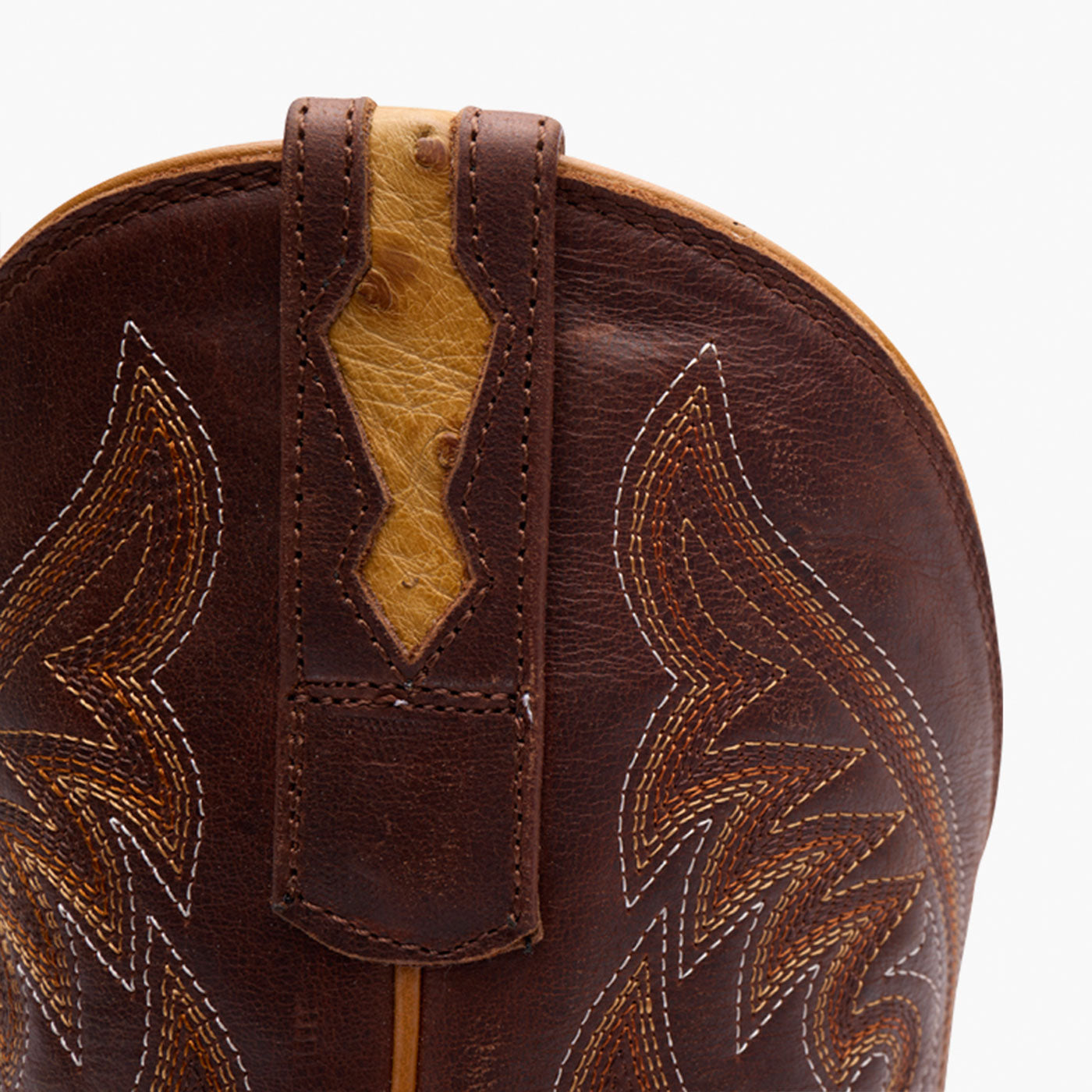 Close up of Durango brown ostrich boot with leather underlay in pull tab