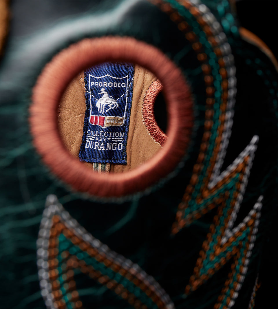 Close-up of a boot with a Durango brand label on a dark background