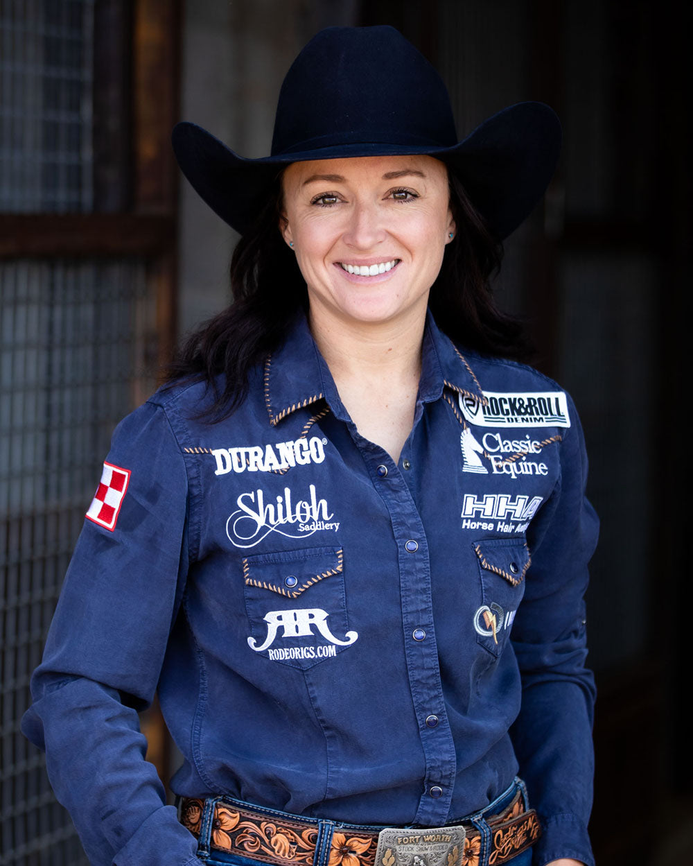 Team Durango Barrel Racer, Jordon Briggs posing at a stable.