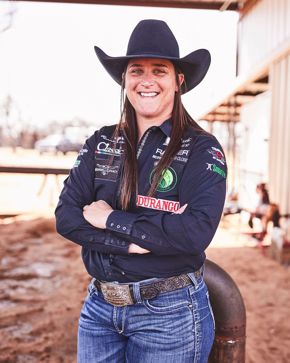 Team Durango Breakaway Roper, Kelsie Domer posing at a barn.