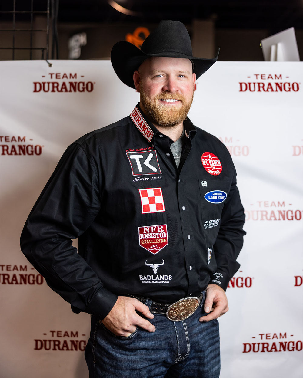 Team Durango member, Will Lummus, Steer Wrestler, posing at NFR.